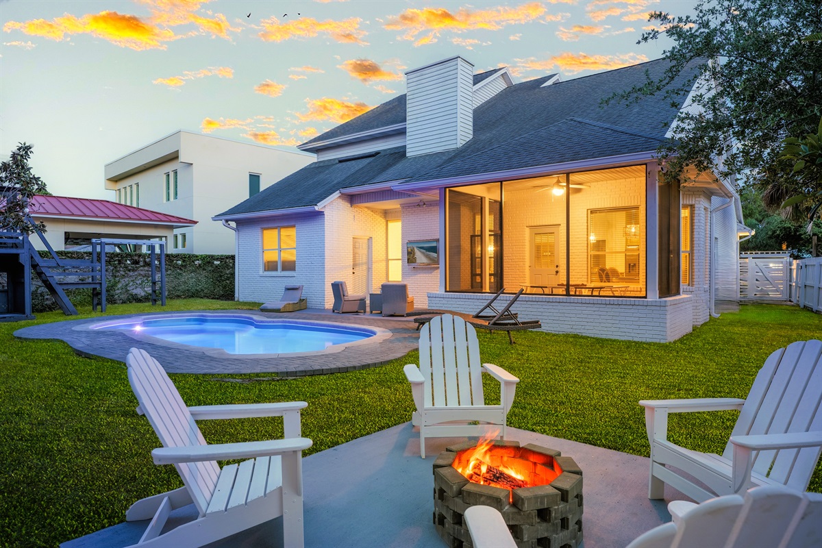 Relax and recharge in this beautiful backyard space with a heated pool
