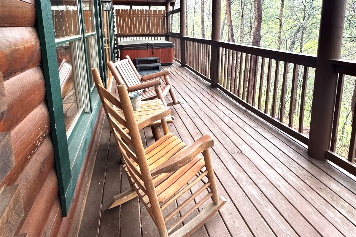Peaceful deck for chatting or soaking in hot tub.