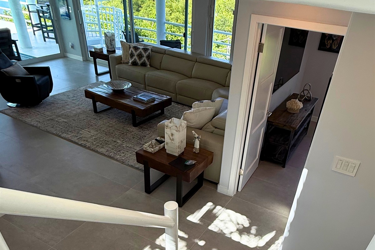 Walk down the steps to an even larger living room