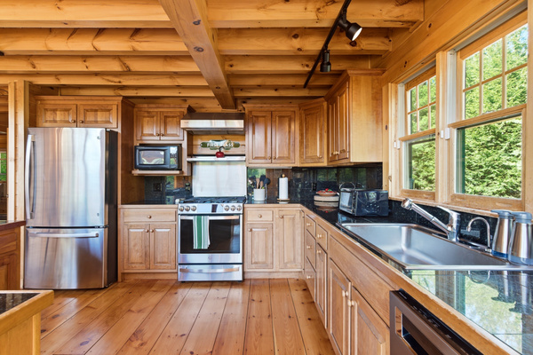 Featuring ample counter space, modern appliances, and everything needed for group cooking.