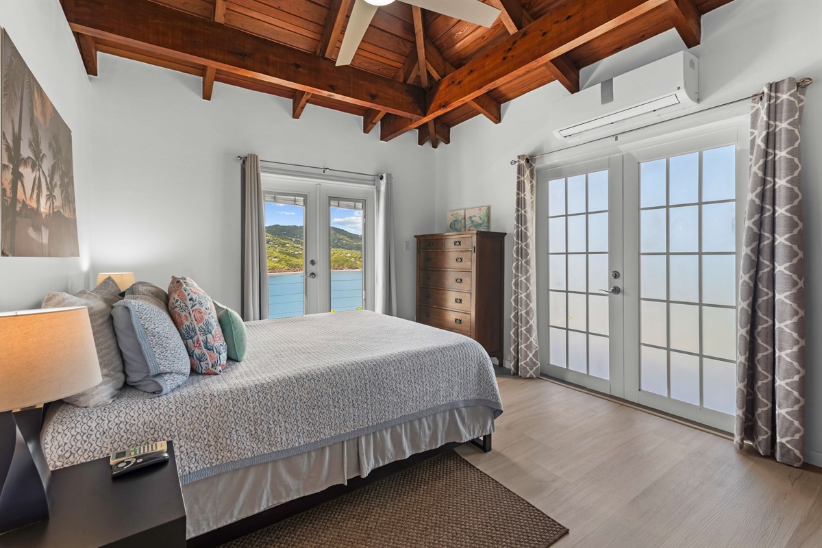Queen bedroom, second bedroom on the main floor that has gorgeous views of Magen's Bay.