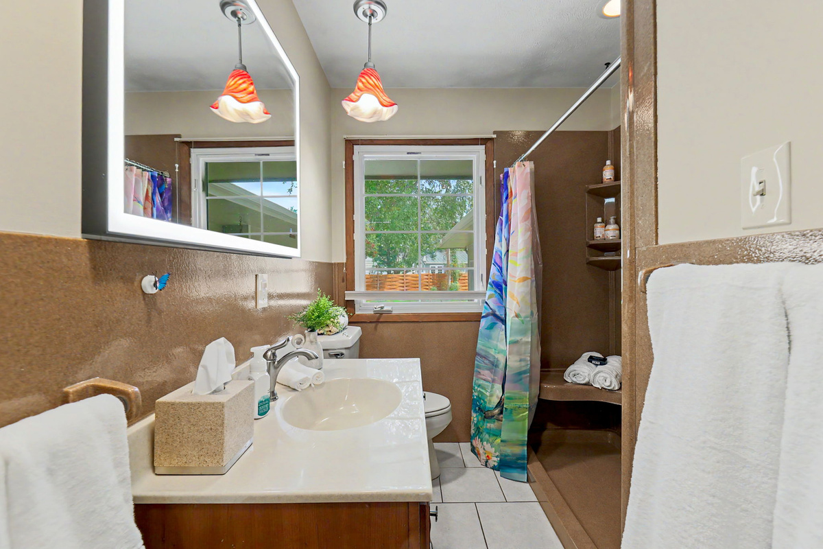 Walk in shower, spacious vanity, and upgraded vanity mirror