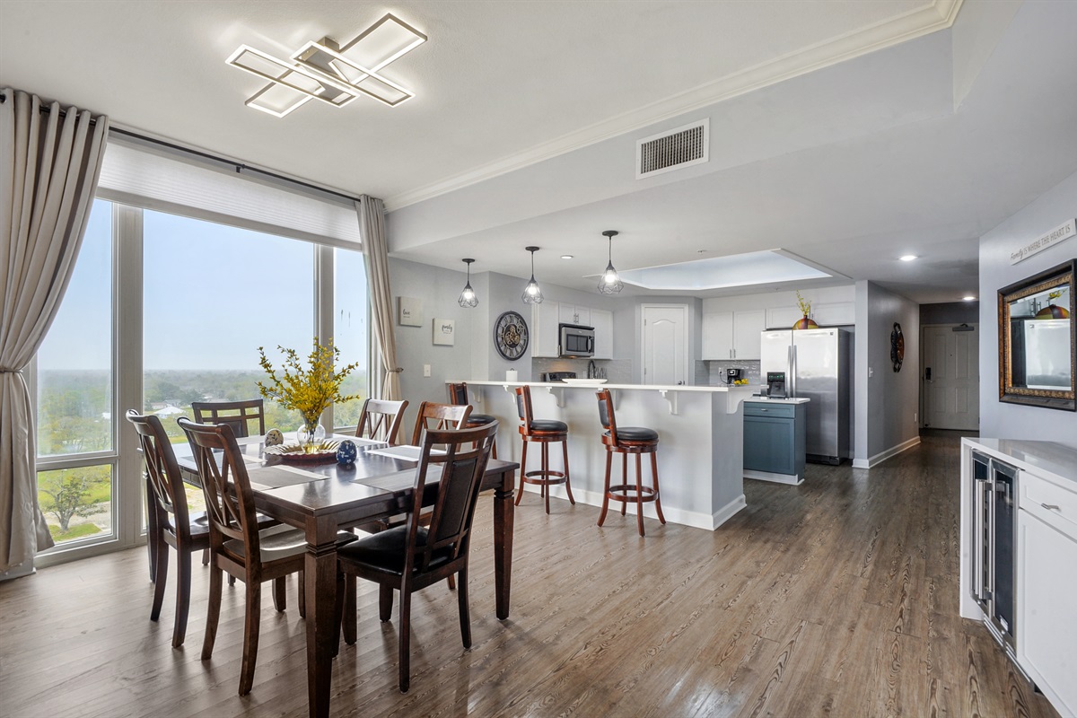 Dining and kitchen; additional folding table and chairs in the closet.