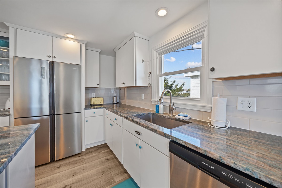Clean, bright kitchen with stainless appliances, generous counter space, and plenty of storage for easy meals at home