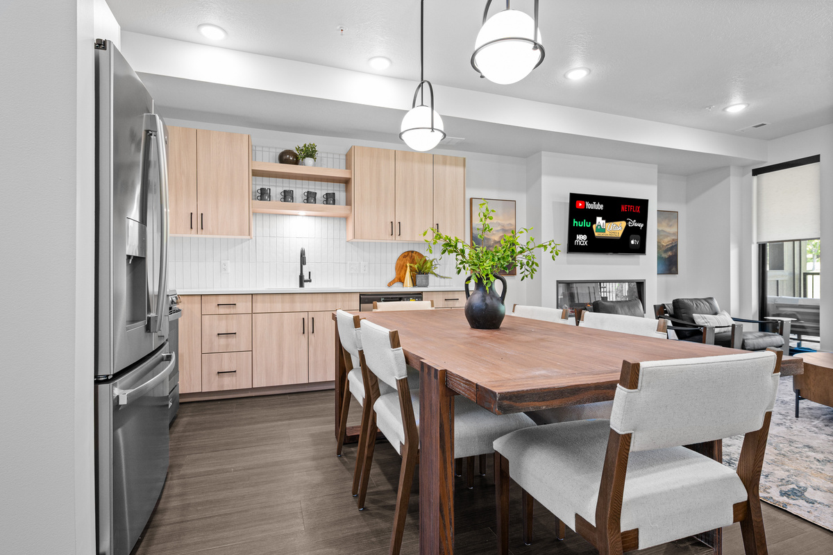 Gather around the dining table for meals, games, and conversation.