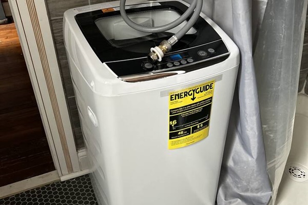 Compact washer and spin dryer. Not large enough to do full sets of sheets or comforters.