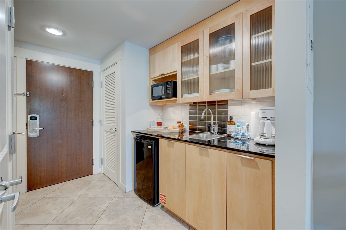 As you enter the studio the kitchenette will be to your left and the full bathroom is to your right.