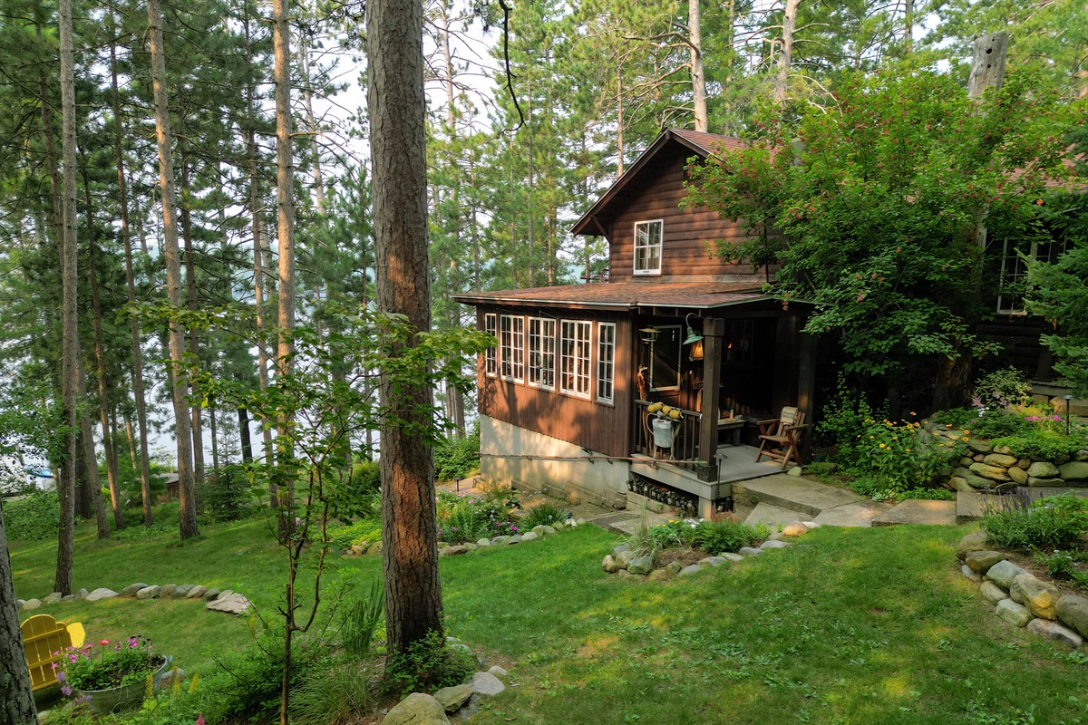 The main lodge set within pines and gardens with amazing lake views