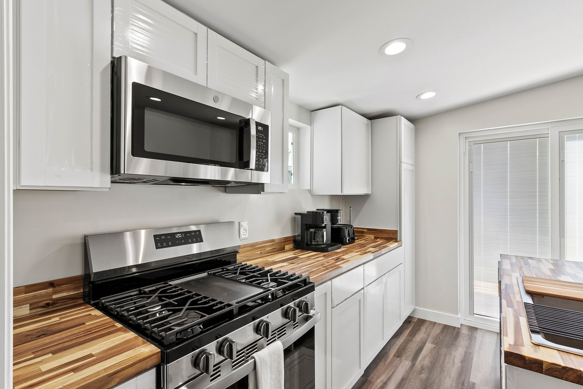 The Waterbury Way - Kitchen with Dual Pot Keuring Coffee Maker and coffee accessories