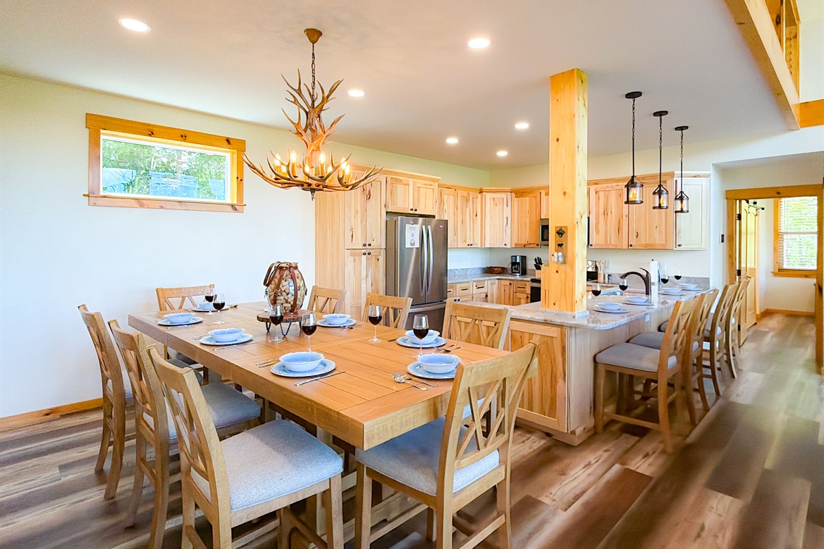 Large dining table for up to 8 persons. Additional Seating at the bar top.