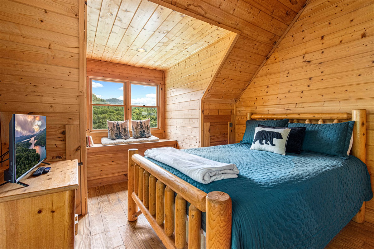 Upstairs Bedroom 2: Serene mountain views and rustic charm await your perfect getaway!