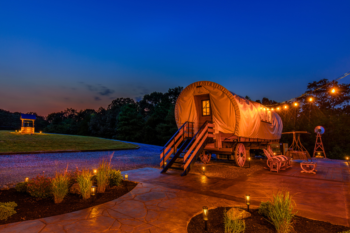 Golden evening lights, private patio space, and a one-of-a-kind romantic wagon escape.