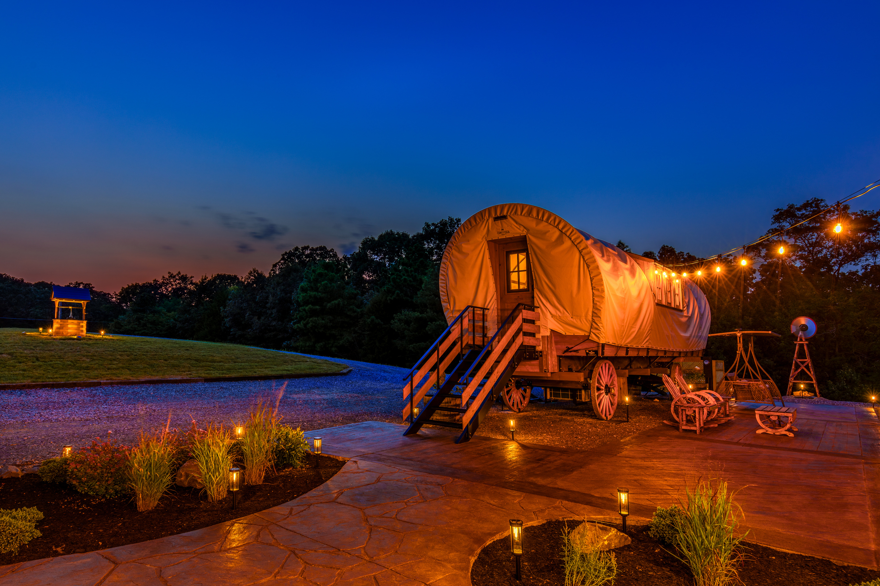 Golden evening lights, private patio space, and a one-of-a-kind romantic wagon escape.