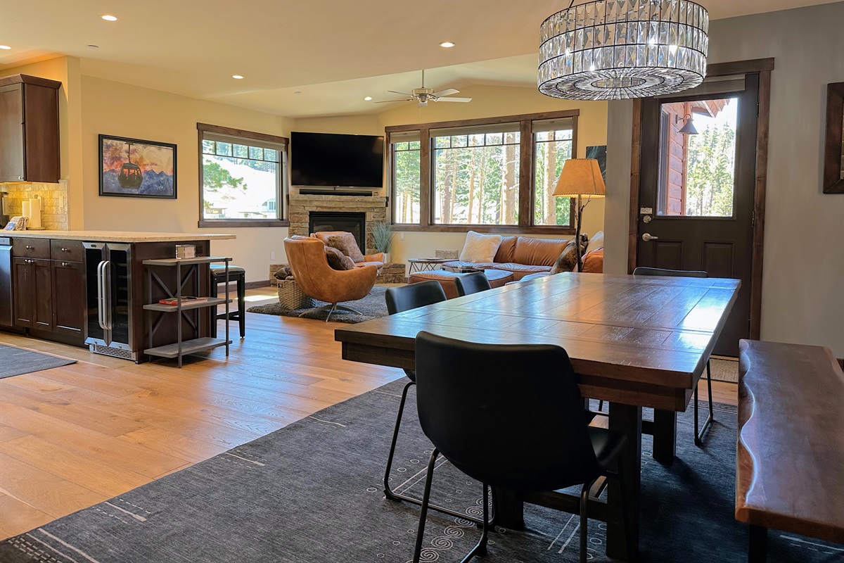 Gather ’round the long table with bench seating—perfect for group dinners, game nights, or even remote work sessions. With the dining room open to the kitchen and living rooms, everyone stays connected while doing their own thing.