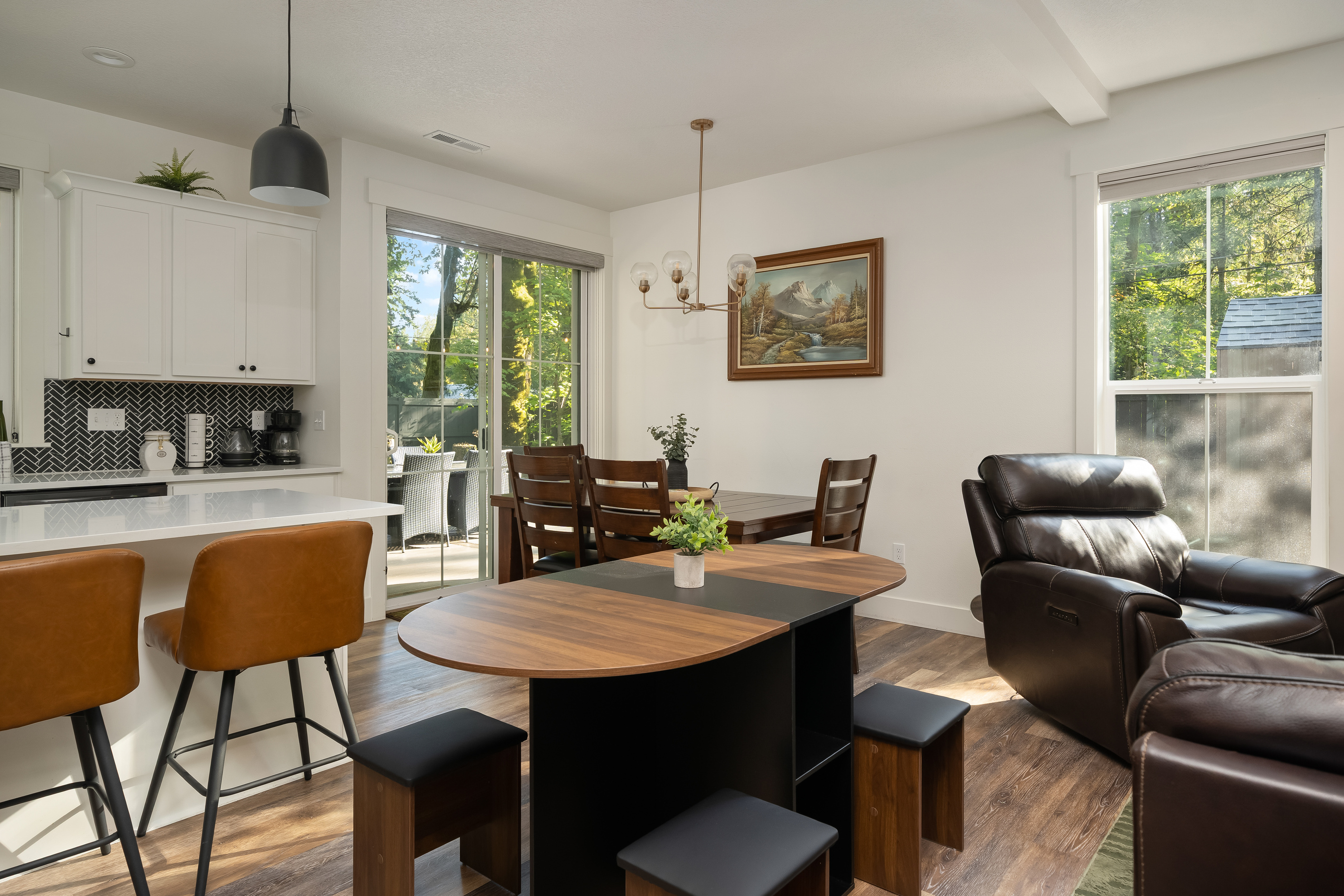 More room for everyone! The stylish console table transforms into a full dining table with chairs stored inside, making it easy to seat all 14 guests when both homes are booked.