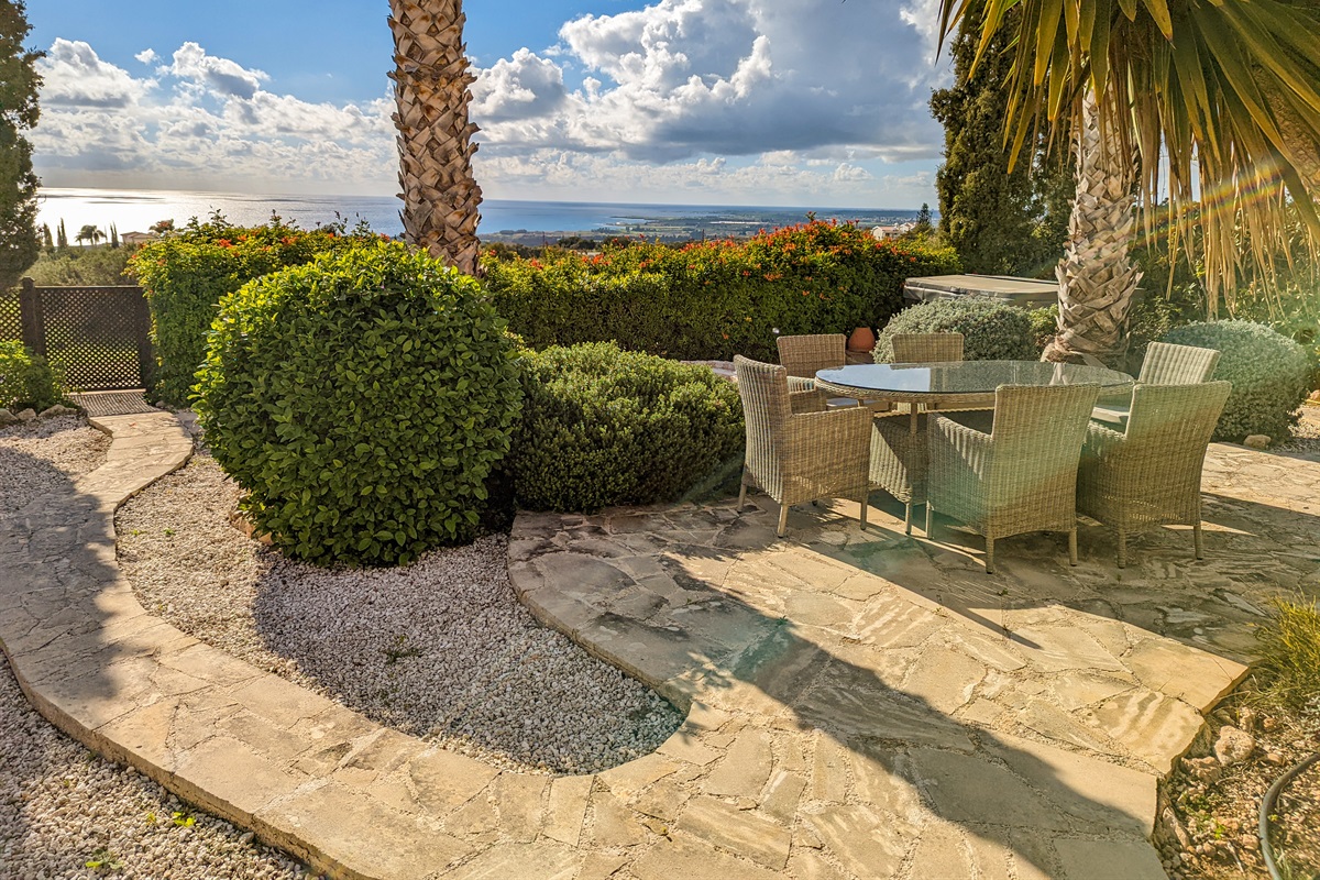 Gather around the second outdoor dining table nestled in the heart of the garden - ideal for breakfast, lunch, or enjoying the sunset.