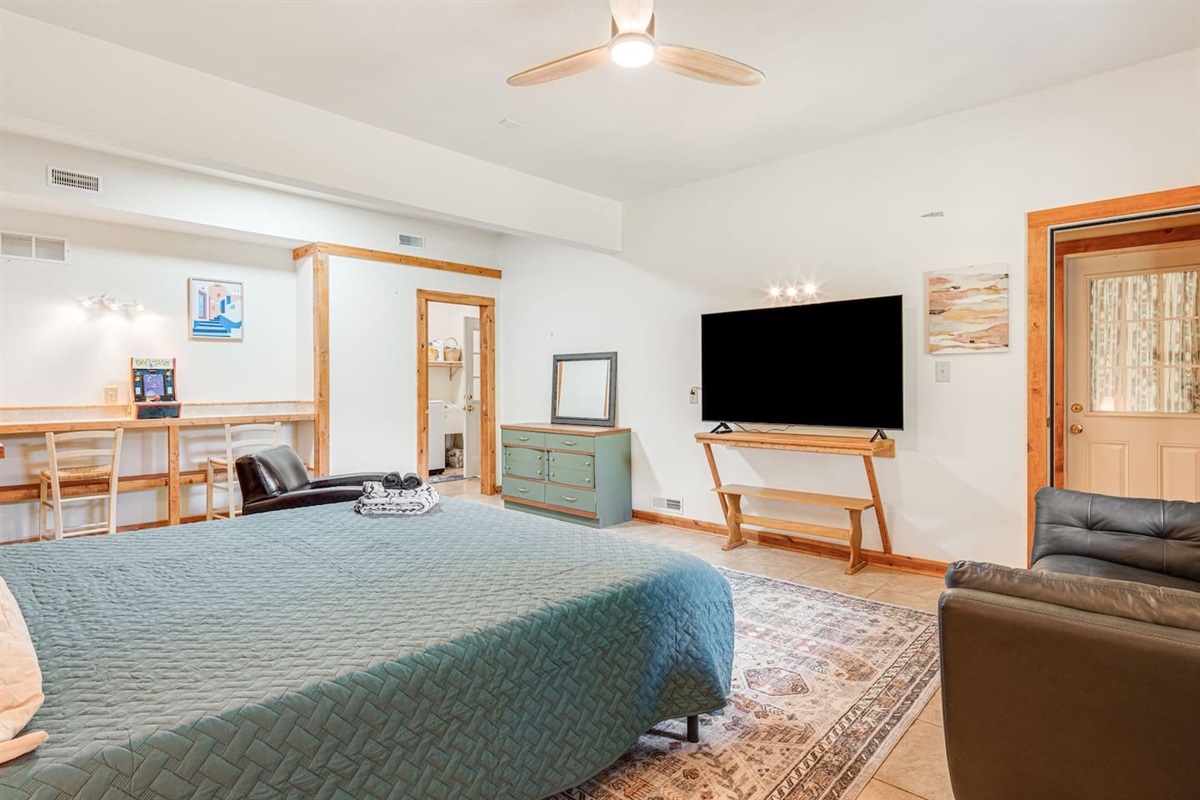 The lower level bedroom has it's own entrance, access to the laundry area, and small kitchenette.