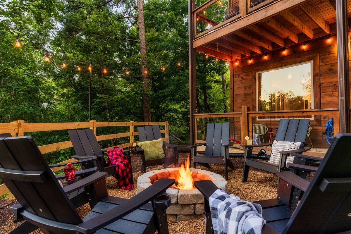 Backyard with fire pit and string lights