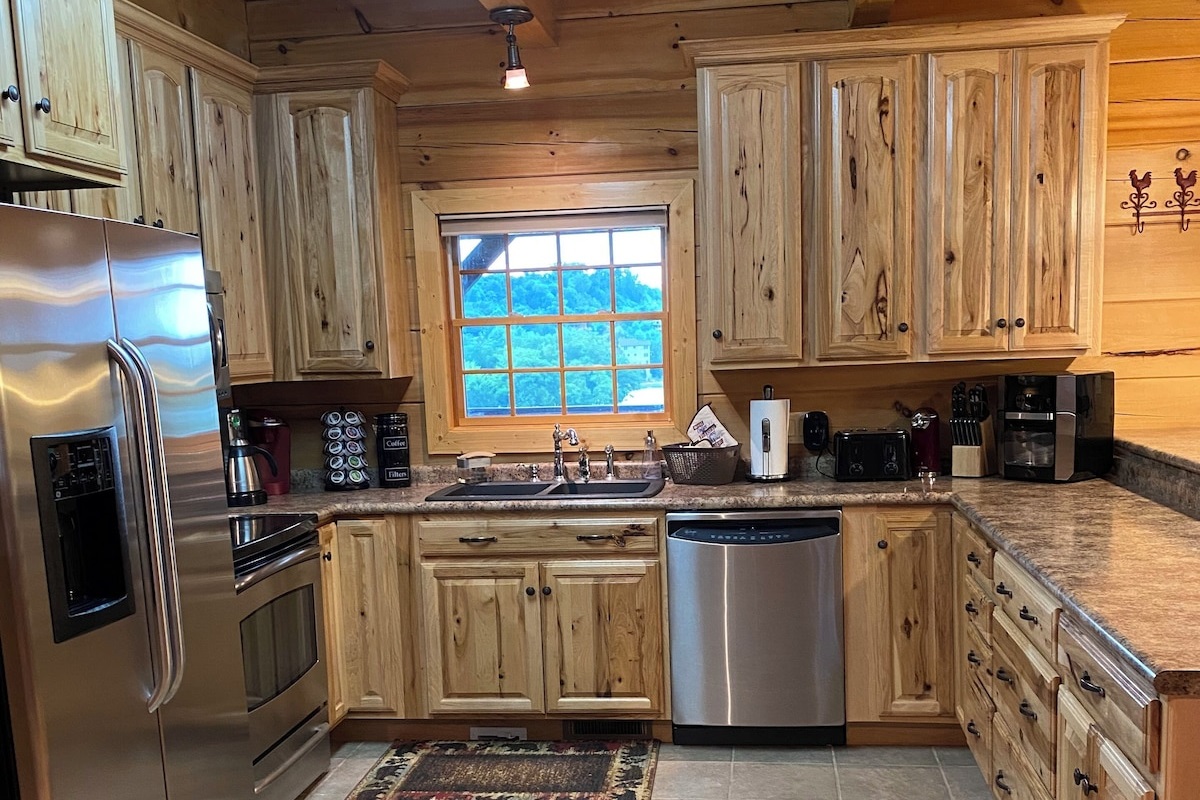 The kitchen has high-quality appliances (refrigerator/freezer, range, microwave, dishwasher, 2 coffee makers (Keurig,Drip), high-quality Hickory cabinets, lots of cabinet space (supplemented with more cabinets in the dining area) and a window to the lake. 