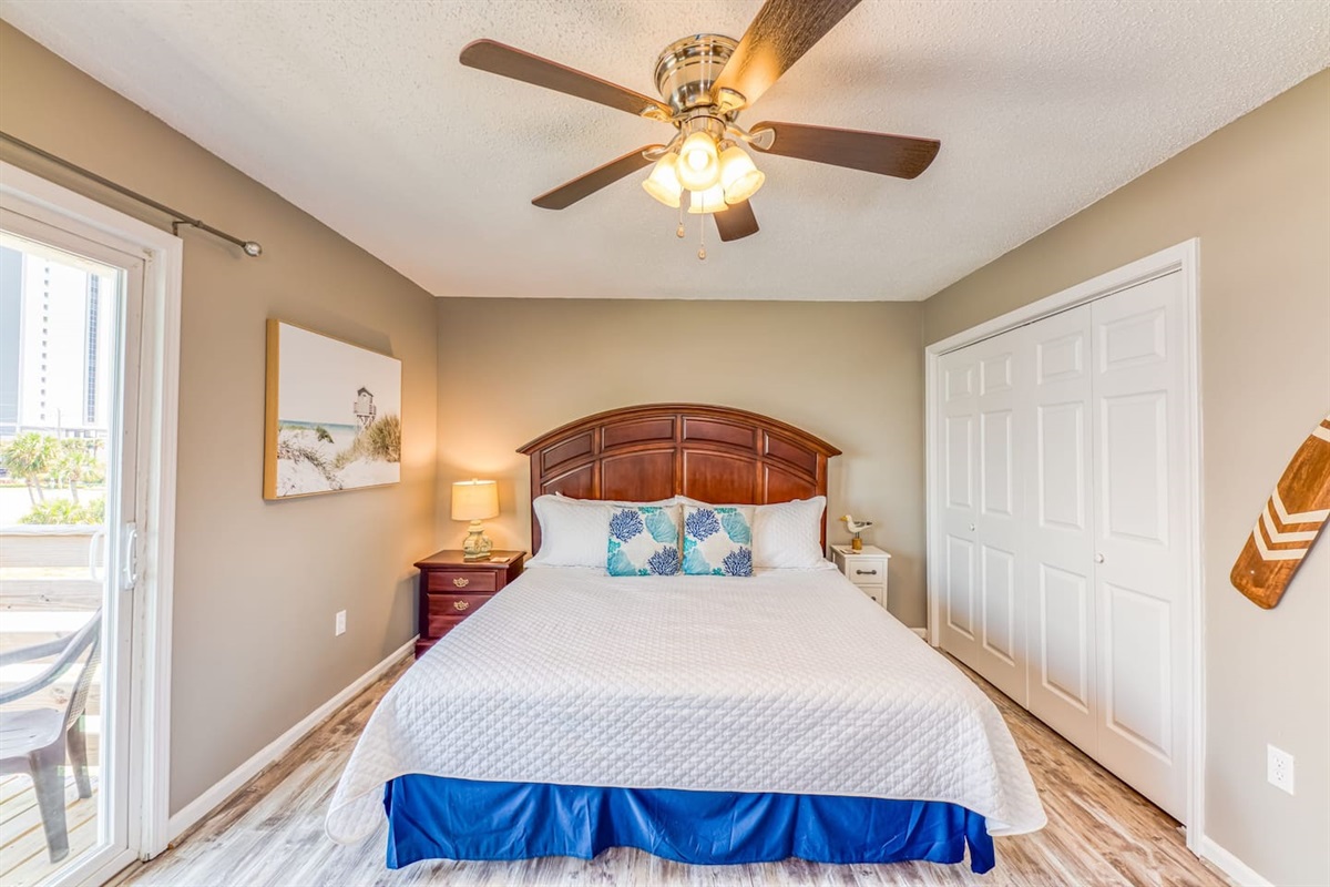 Bedroom Retreat: Bright and airy space with sleek decor, perfect for beachside relaxation!