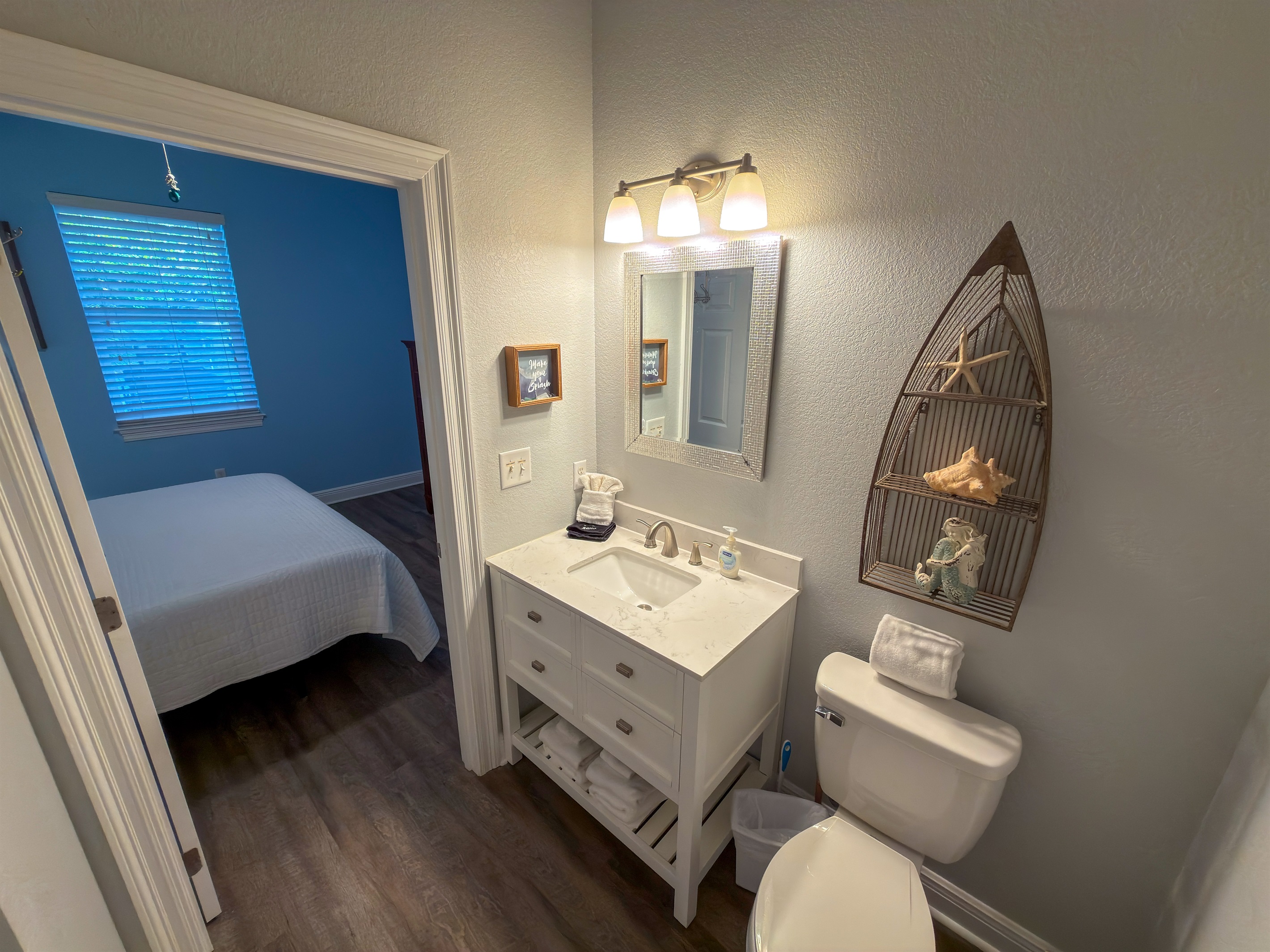 Bright modern finishes and direct bedroom access create a private bath designed for ease and everyday convenience.