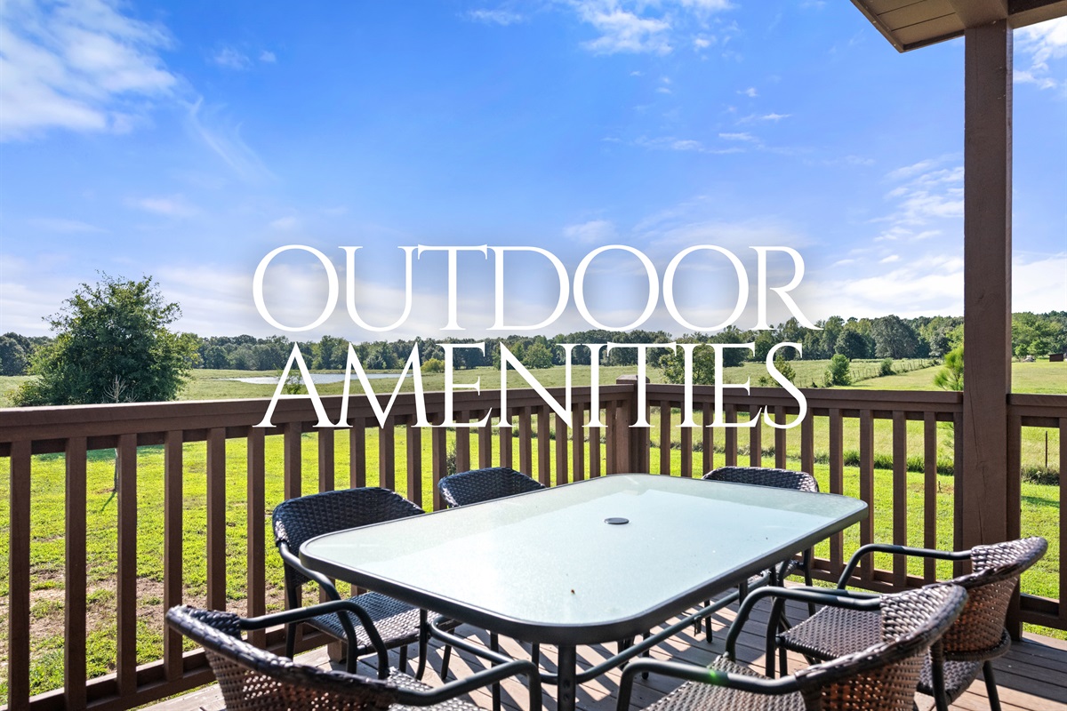 Outdoor dining area with table and seating, overlooking scenic views.