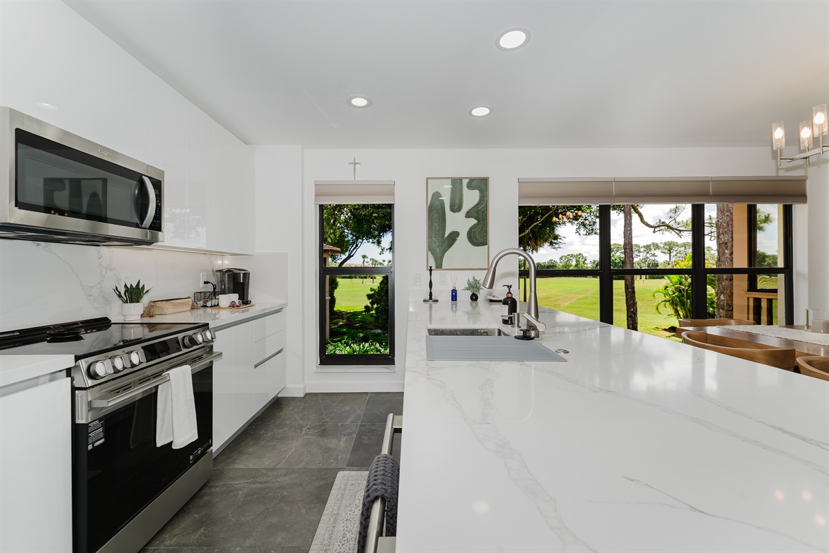 Fully equipped kitchen with everything needed for home-cooked meals. Modern appliances and ample counter space for easy meal prep. Bright and functional kitchen perfect for extended stays.