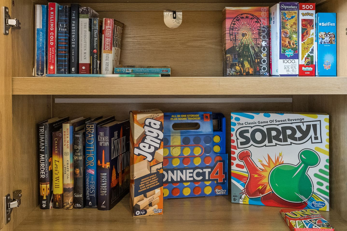 Board games, puzzles, and books available to enjoy as a family.
