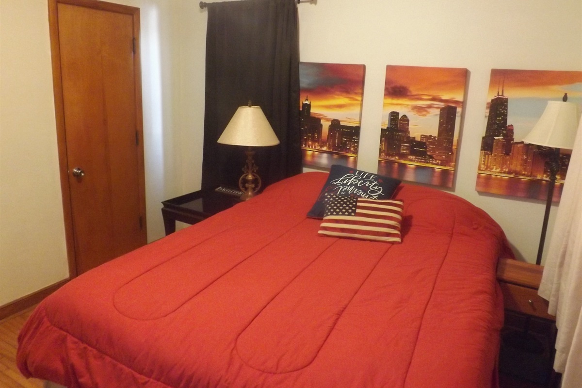 Queen bed with Roku Smart TV