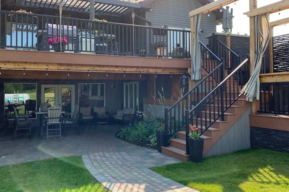 SIDE VIEW OF UPPER, LOWER AND HOT TUB DECKS