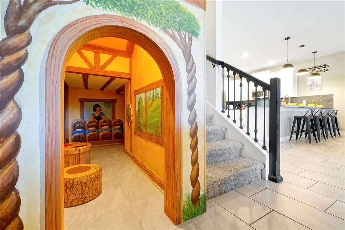 Let your littles enjoy this fun little Snow White & the 7 Dwarves themed play room. Complete with full murals, trump stump stools and wall-mounted magnet games to keep them entertained. Located off the living room so you can keep and eye on them.