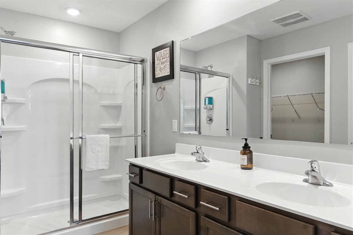 Ensuite bath with glass enclosed shower