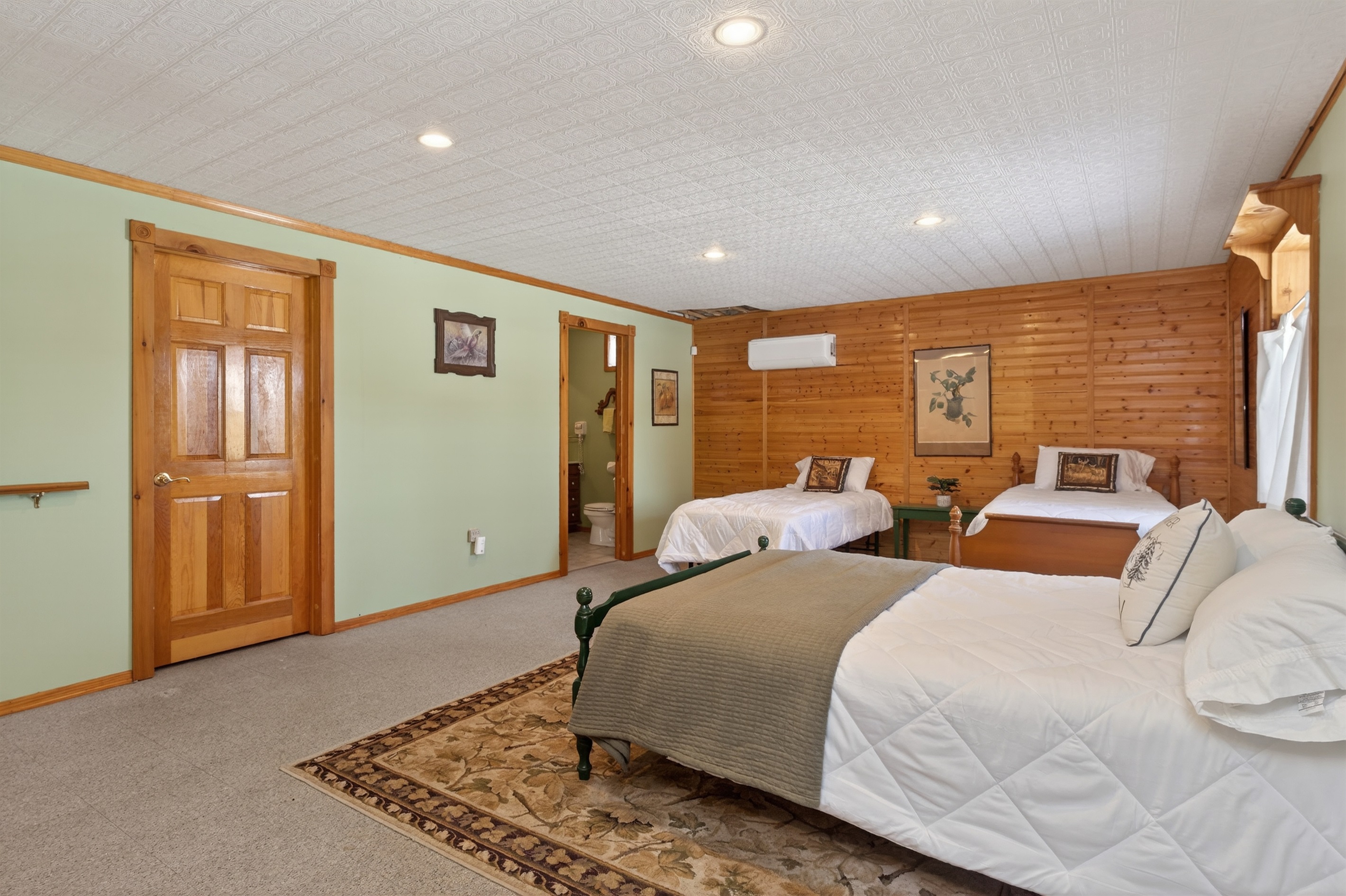 Lower level bedroom # 4 with two twins, a double bed and a queen futon 