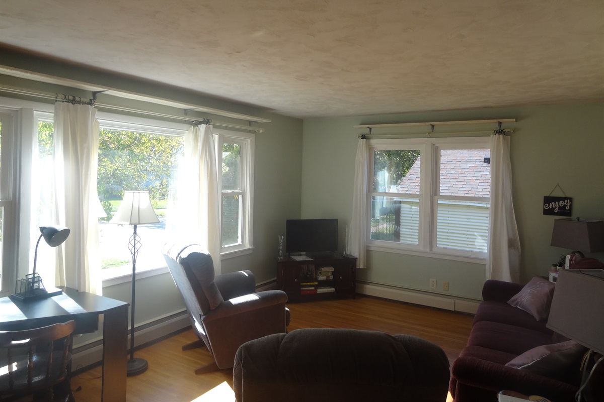 Full size couch, 2 recliners, Roku smart TV, laptop work space