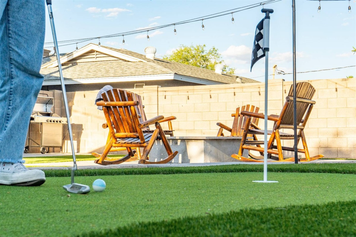 Backyard putting green + firepit lounge—perfect for sunset hangs and friendly competition.