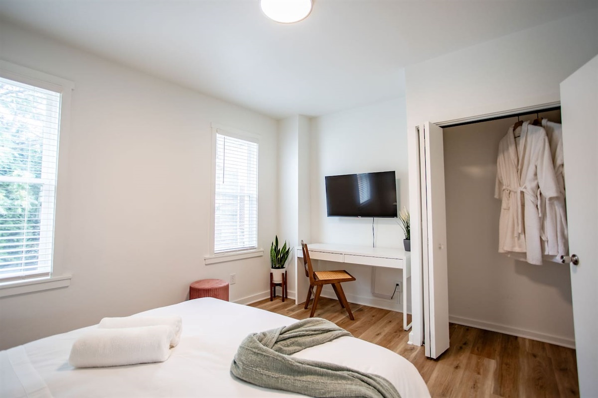 Bedroom with TV and dedicated workspace