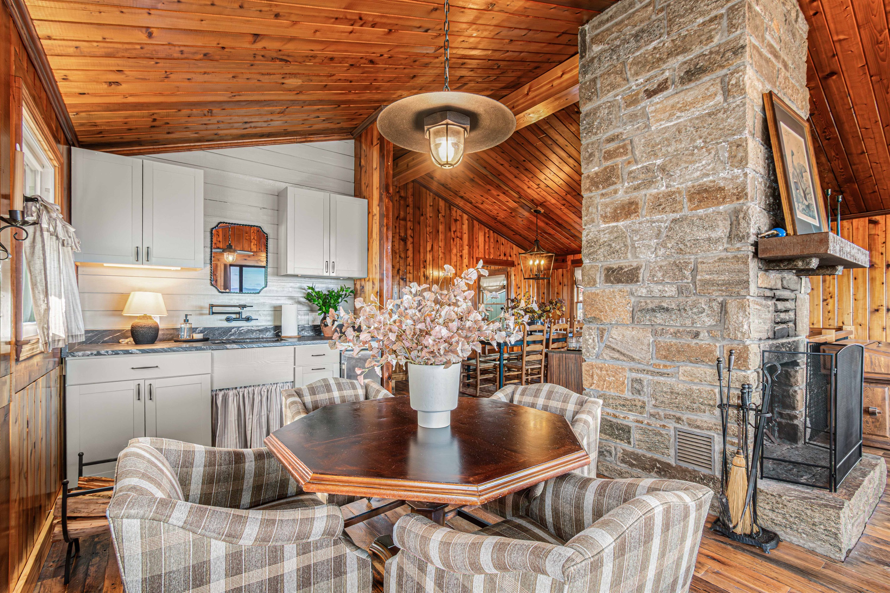 The old side kitchen blends rustic character with modern function, offering a warm, nostalgic feel while staying fully equipped for everyday meals and group gatherings. 