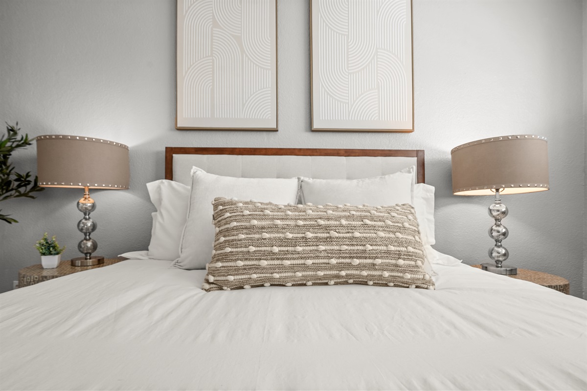 Cozy upstairs bedroom with a queen bed and relaxing atmosphere.
