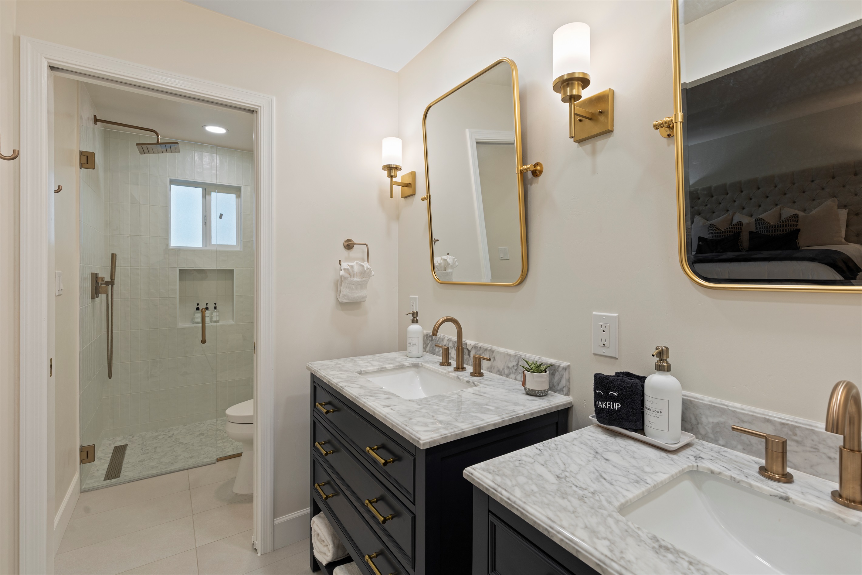 Spacious master bathroom with walk-in shower and dual vanities