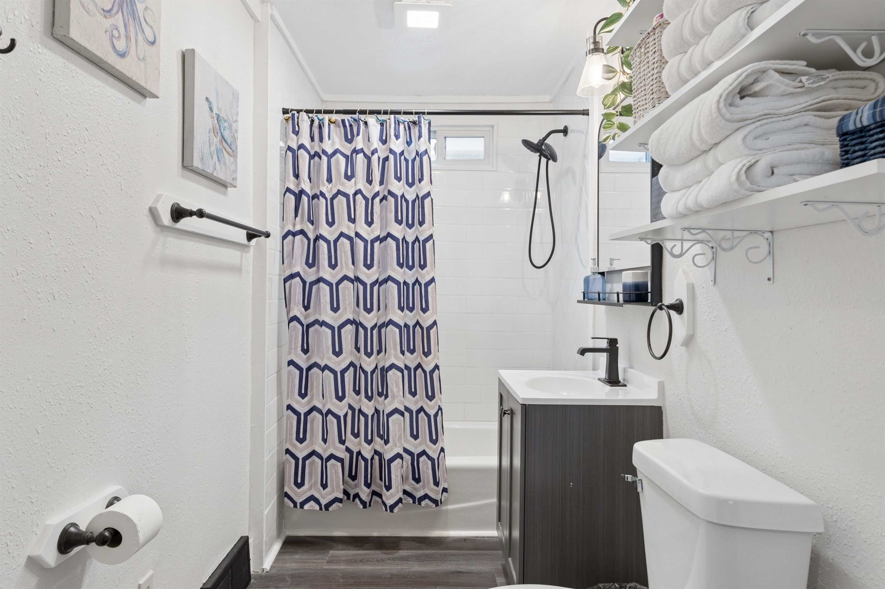 Aspen offers a full bathroom with hand-held shower and tub.