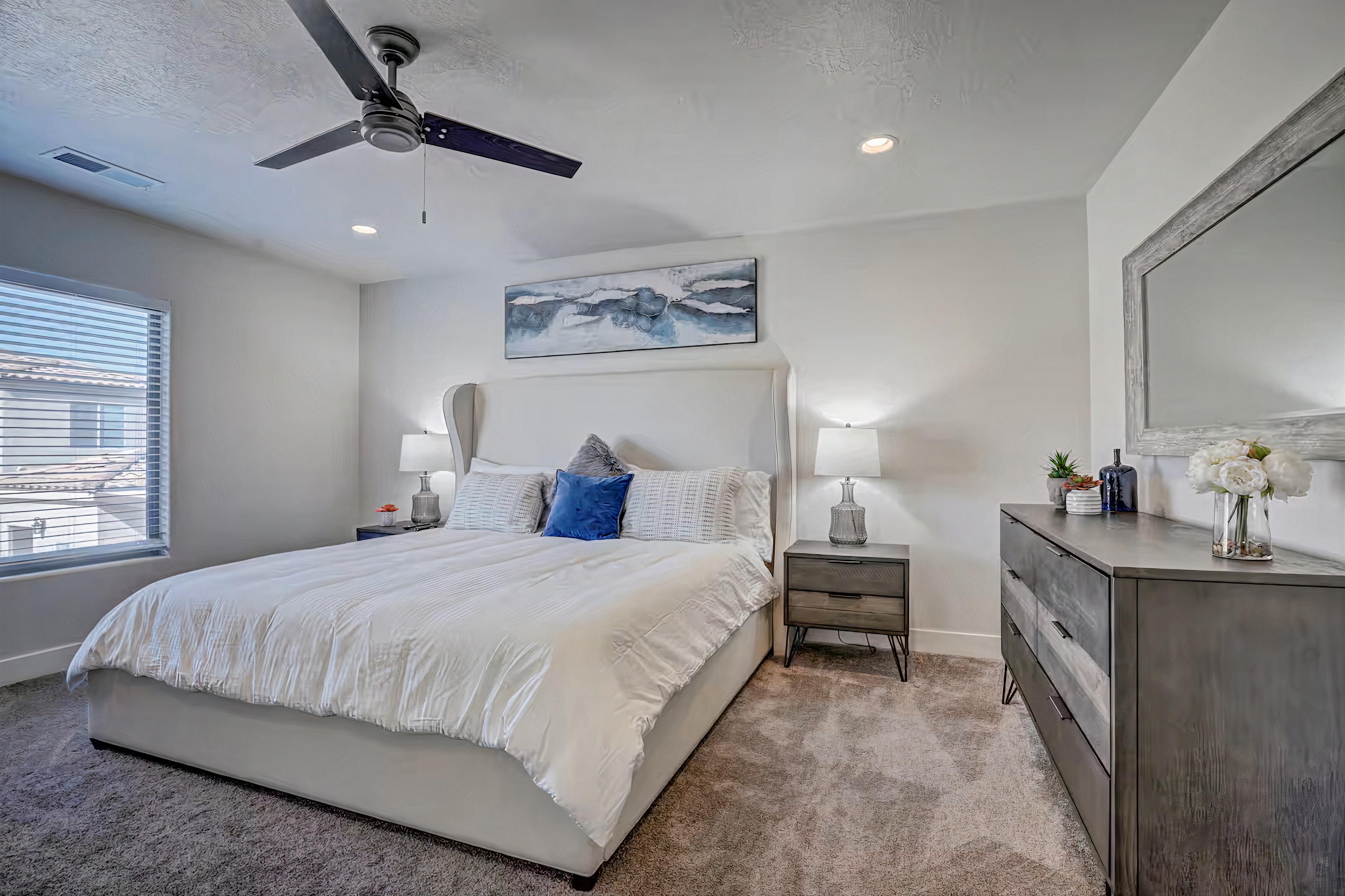 Luxurious California King bed in master bedroom.