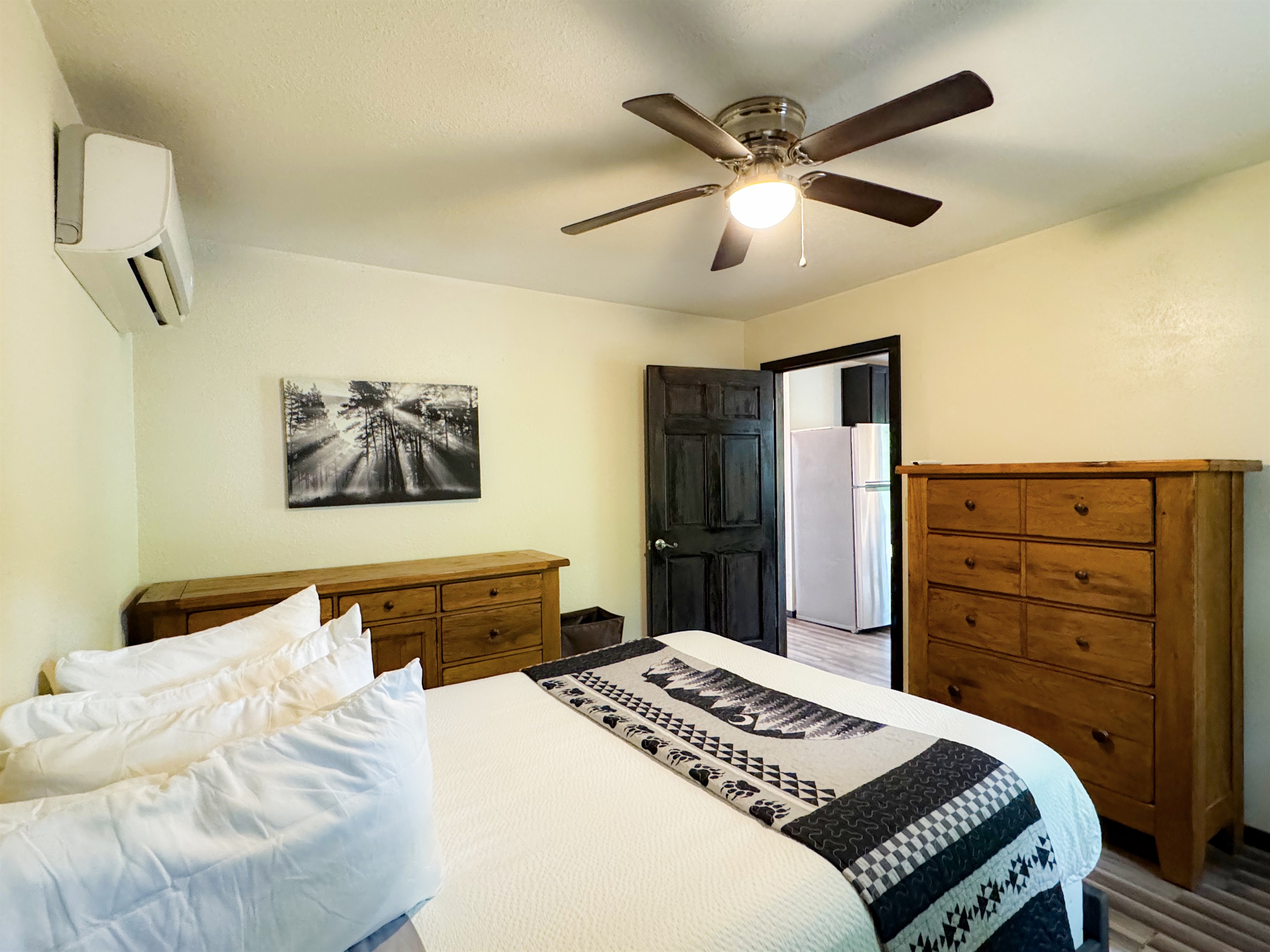 The apartment bedroom has a queen size bed, its own living space and bathroom