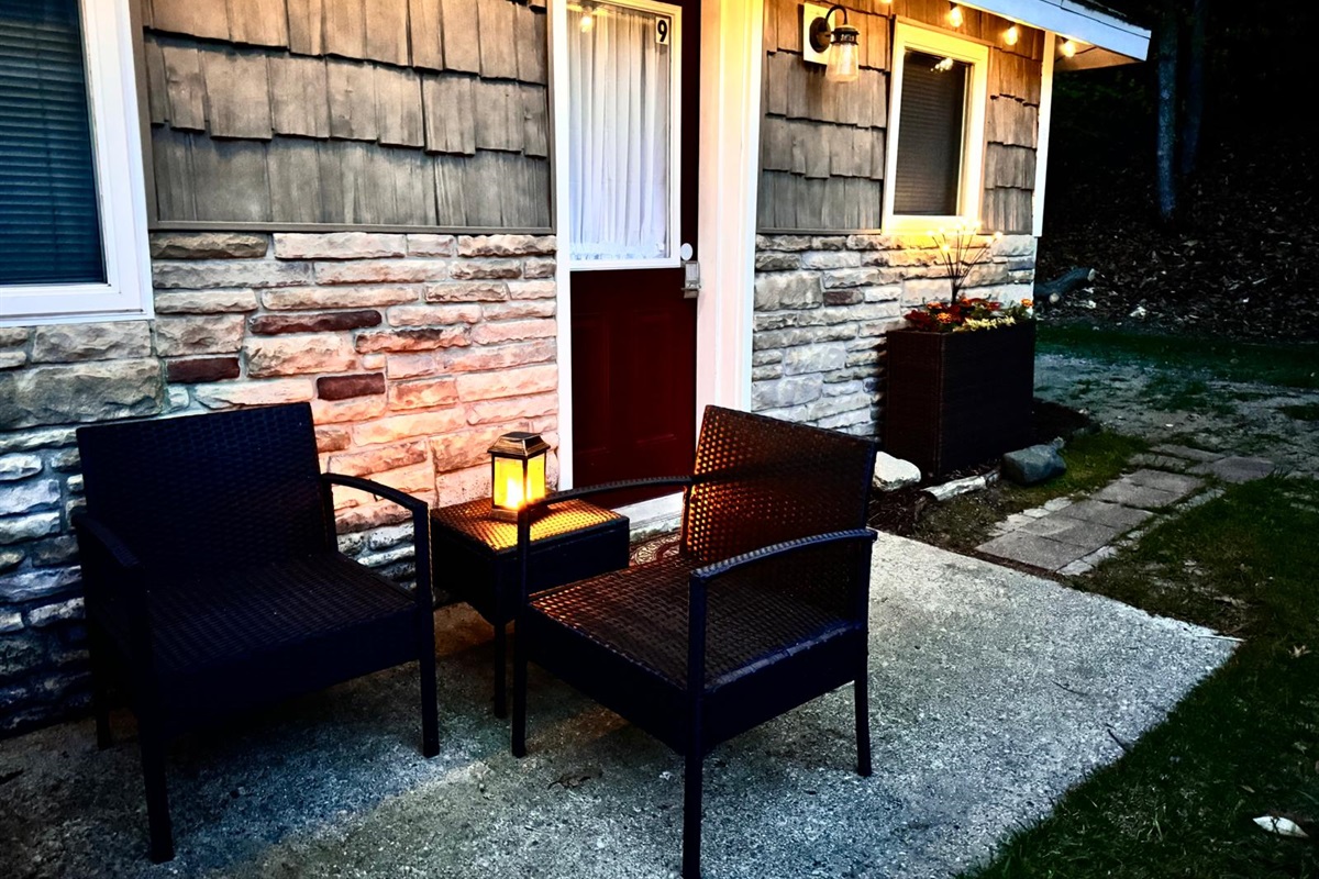 Dedicated door takes you to the back patio with a bistro set, umbrella, solo stove, charcoal grill and romantic string lights to enhance your stay.