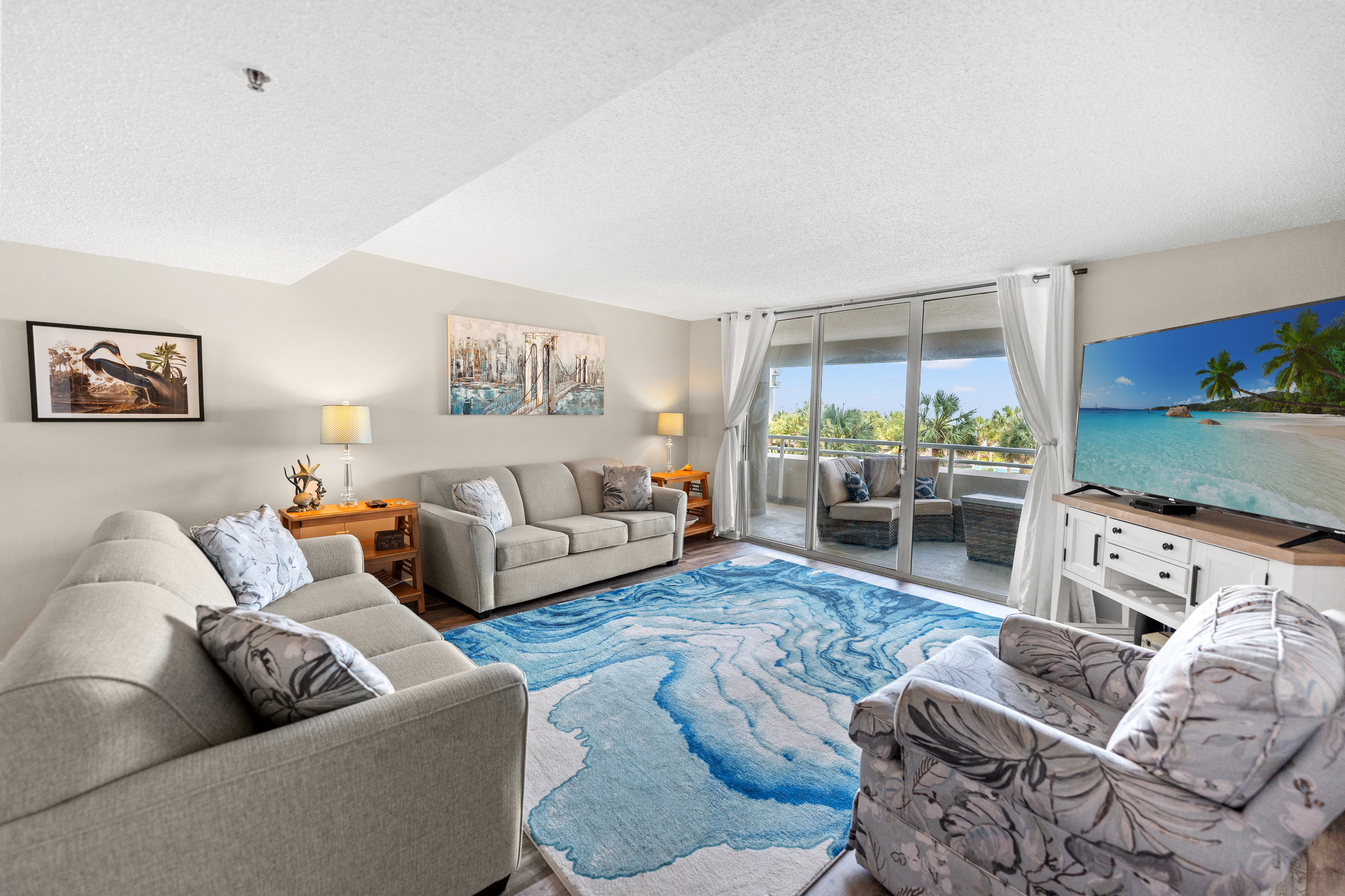 Oceanfront Living Room area with sleeper sofa, TV and balcony access