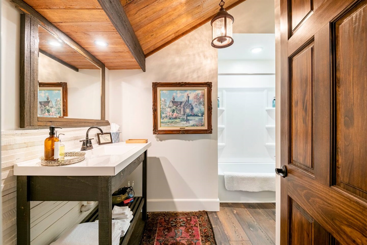 This third bathroom located downstairs is considered the shared bathroom and often gets used by those sleeping upstairs.