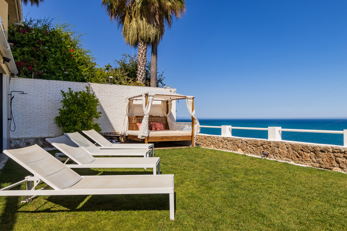 Sun loungers in the private garden overlooking the sea