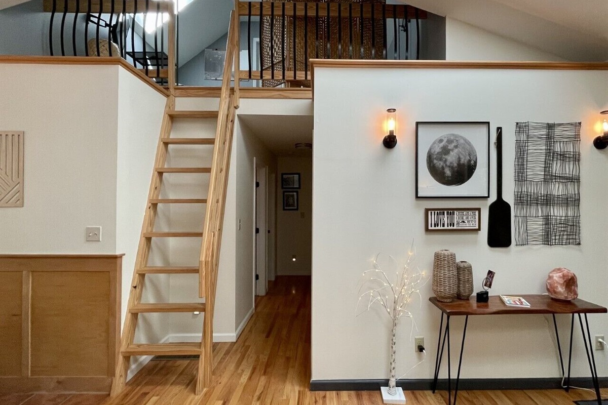 Wooden ladder to loft. This is considered a bonus room. 