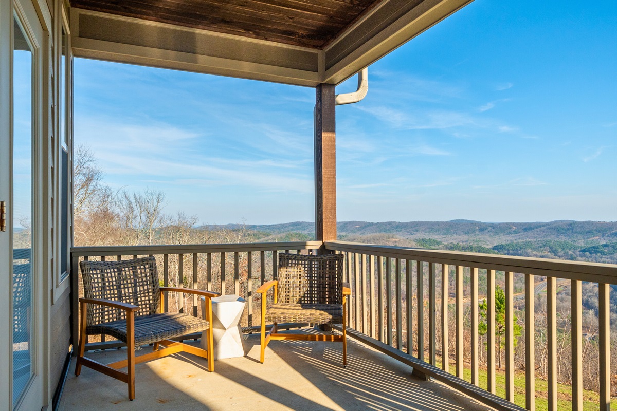 A pair of rocking chairs on the porch offer the perfect spot to slow down, sip your coffee, and take in the peaceful surroundings.