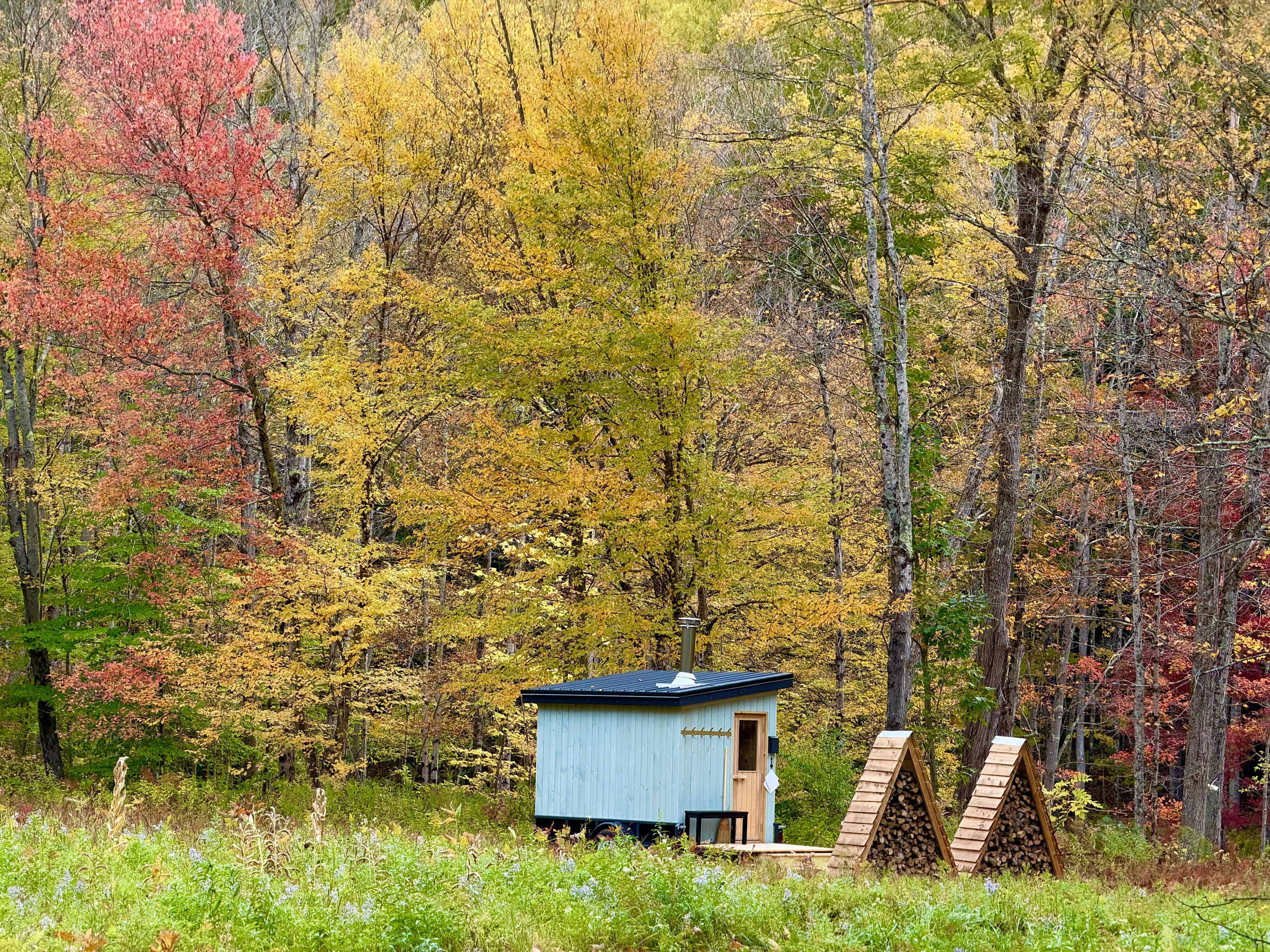Our wood fired sauna + firepit area is located on the banks of The Black River. 
