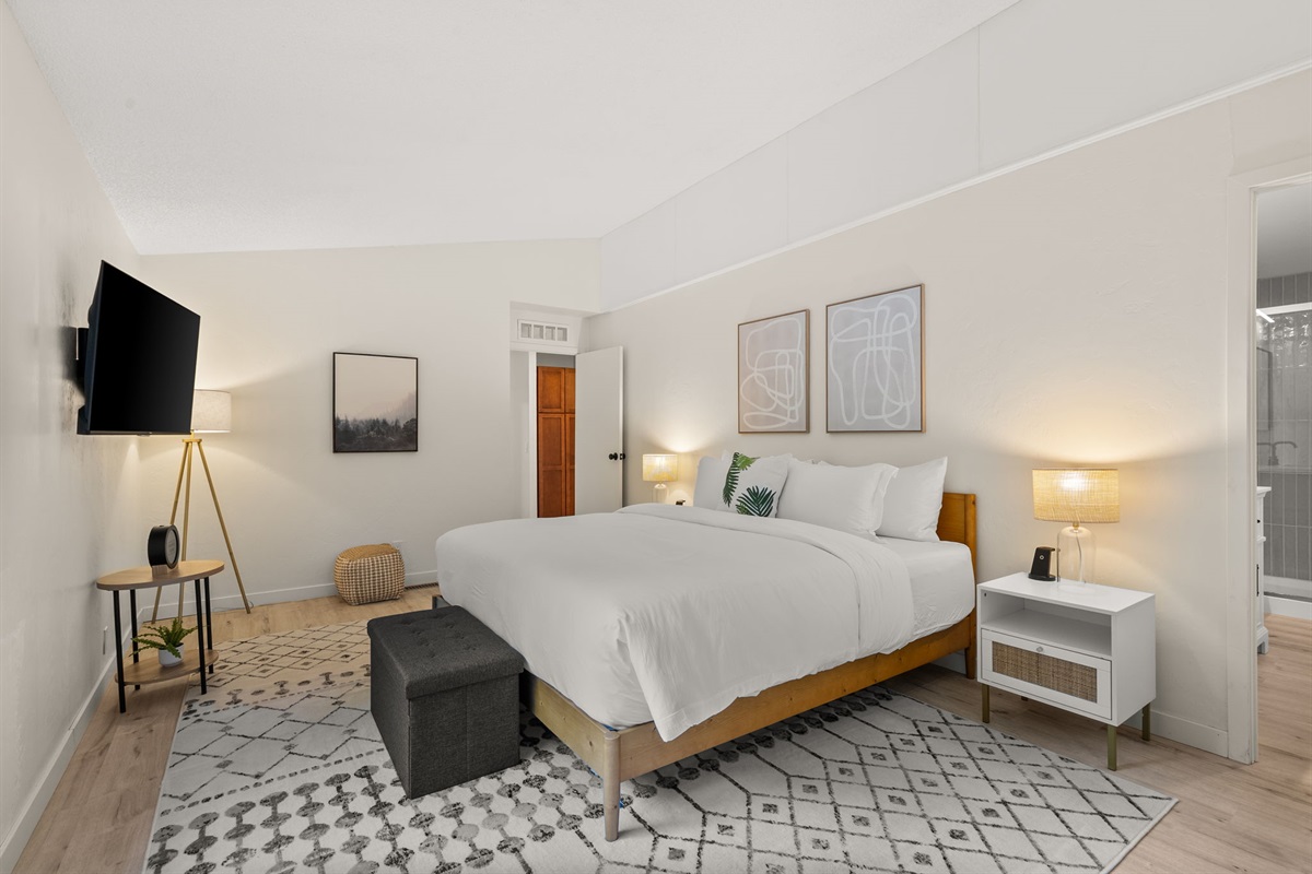 Enjoy the privacy of your own ensuite bath just steps from the king bed in this restful retreat
